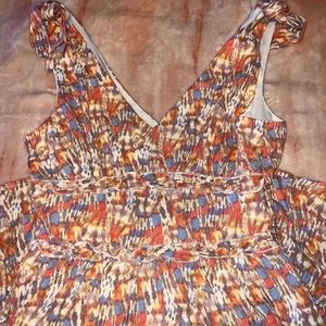 sun dress with tie sleeves and low cut v neck